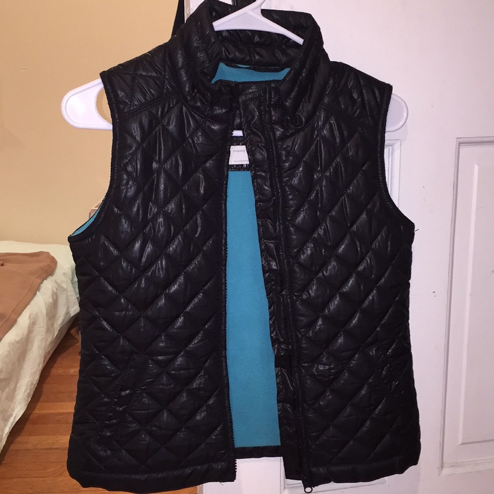 Black and turquoise vest